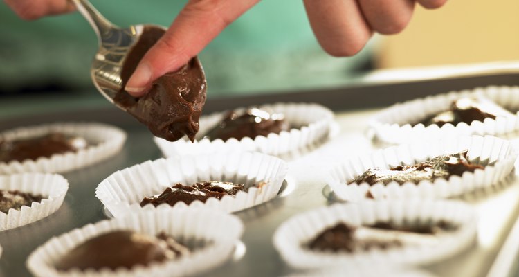 Putting Chocolate Cupcake Mix Into Baking Tin