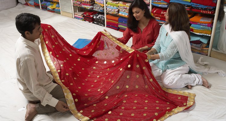 Women selecting sari in sari shop