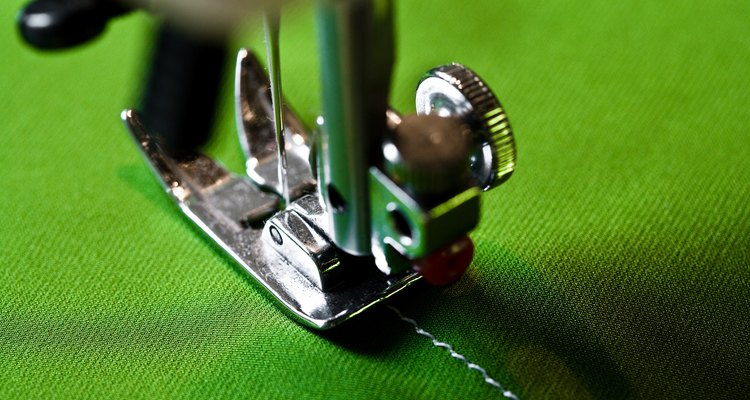 Sewing machine on green fabric