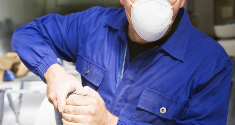 Use metal oxide sandpaper on a sander to degloss paint manually.