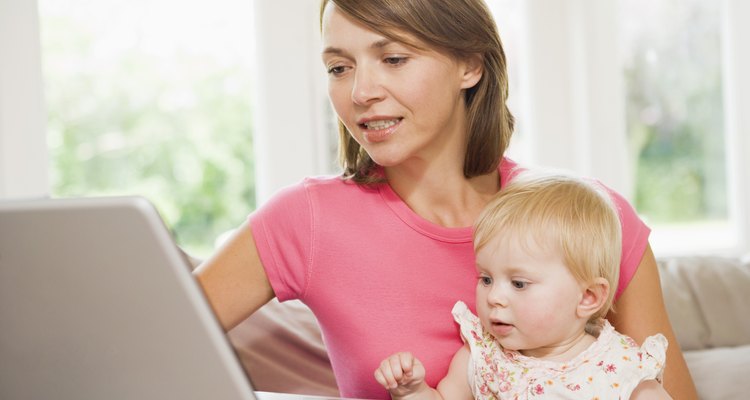 Woman and child using laptop