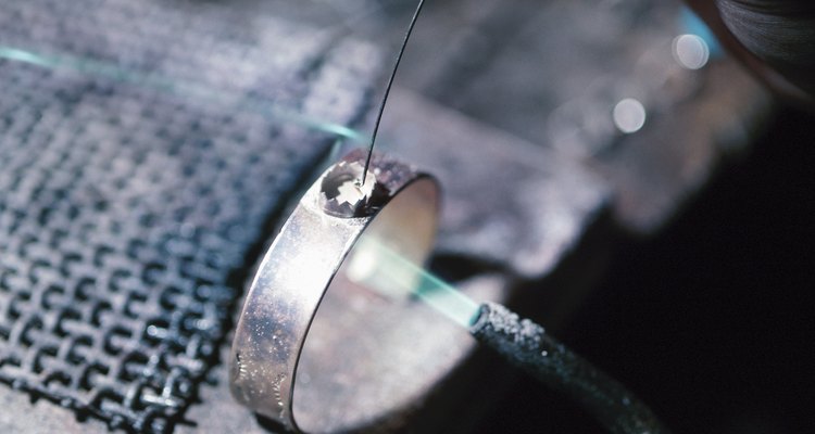A torch used for soldering is an important tool that's part of a jeweller's work bench.
