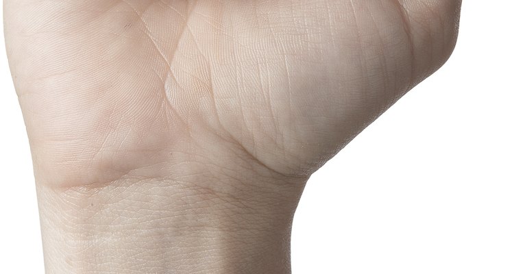 Crack your knuckles loudly by first making a fist.