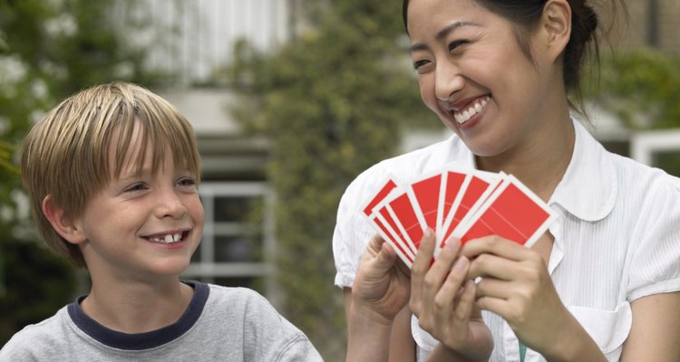 Boy and young woman playing game