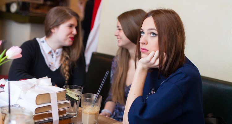 concerned young woman in coffee shop