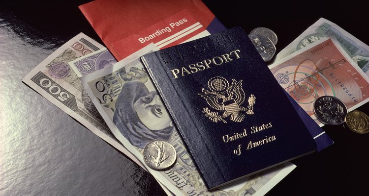 Destroy an old passport to prevent fraud.
