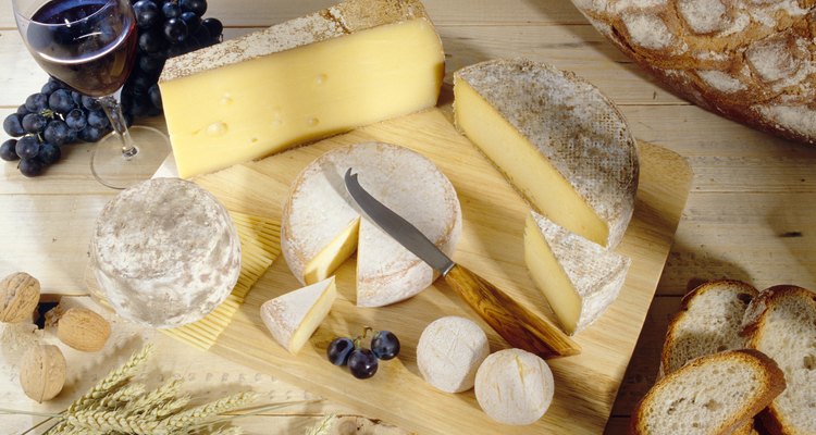 Cheeses on cutting board