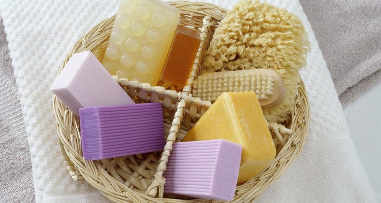 Basket of soaps with a brush and sponge