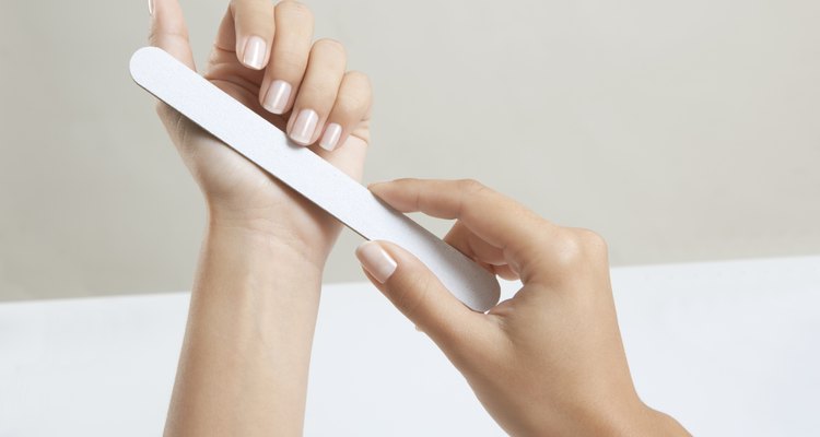 Woman hands with nail file