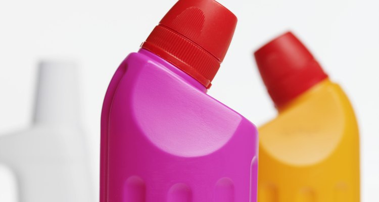 Close-up view of three cleaning product bottles