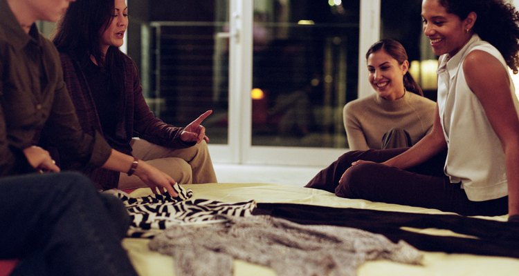 Women Friends Sitting Around Apartment Talking