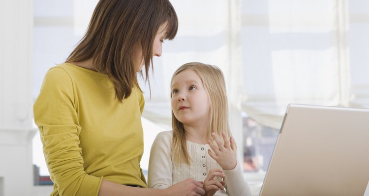 Mother and daughter on laptop computer