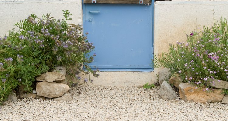 Improve your outdoor space by making a gravel pathway or patio.