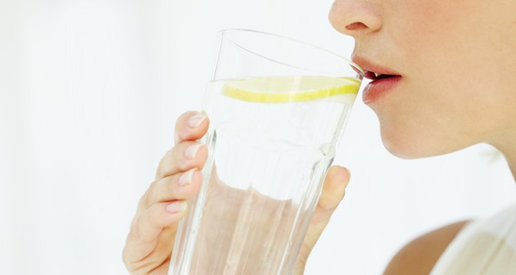 woman drinking a glass of water