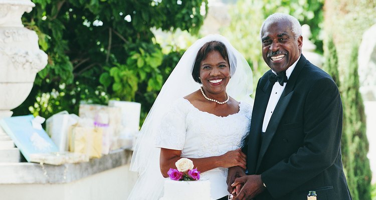 Senior Newlyweds Cutting their Wedding Cake