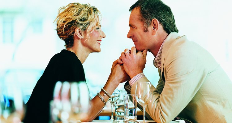 Couple Holding Hands Across a Restaurant Table