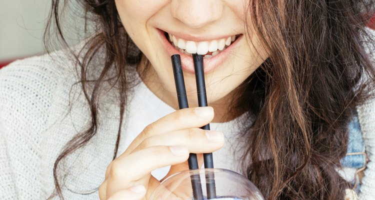 Beautiful girl drinking a smoothie