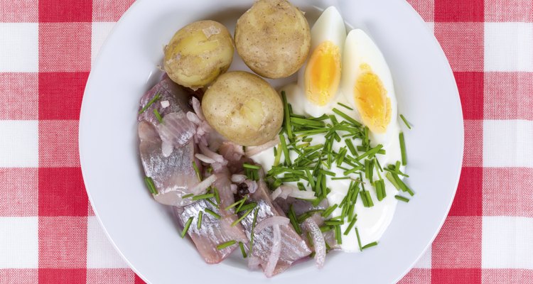 Plate with herring, potatoes and more.