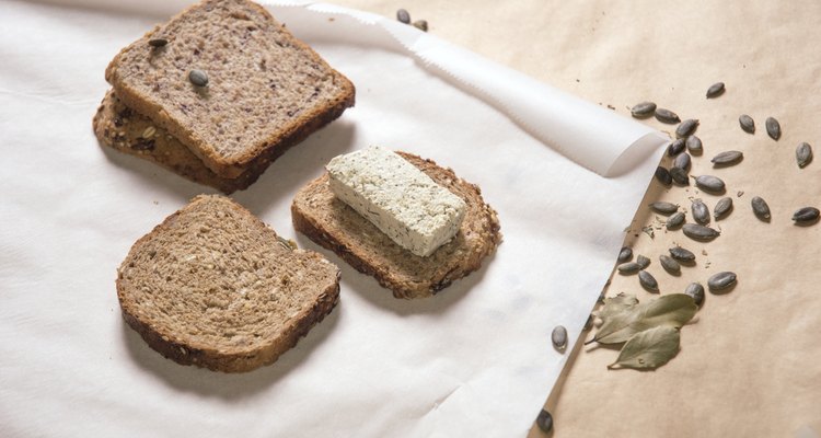 Different kinds of bred with tofu cheese and pumpkin seeds