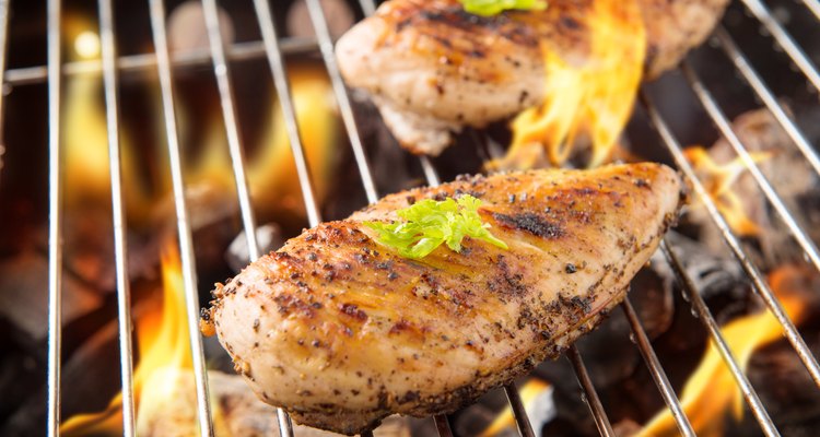 Marinated grilled chicken on the flaming grill