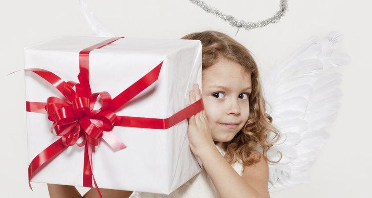 Girl with angel wings and set of gifts