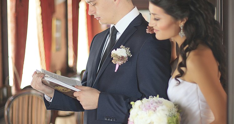 Groom and bride reads the book