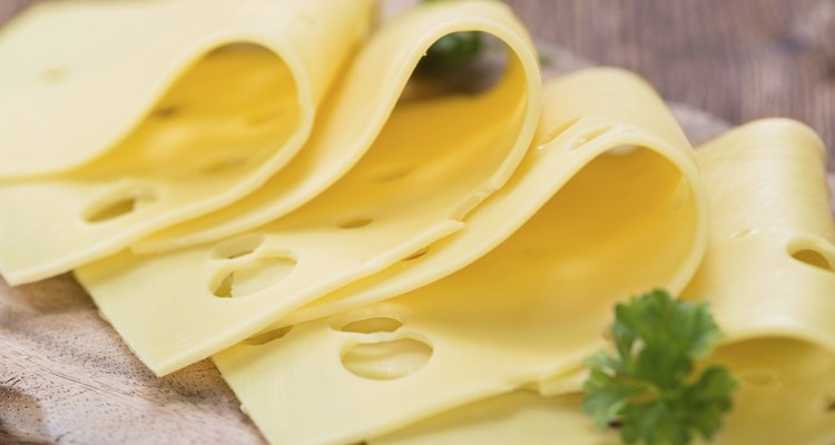 Sliced Cheese on wooden background