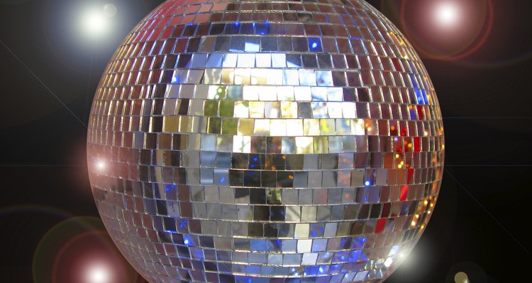 Disco ball with sparkles isolated in black