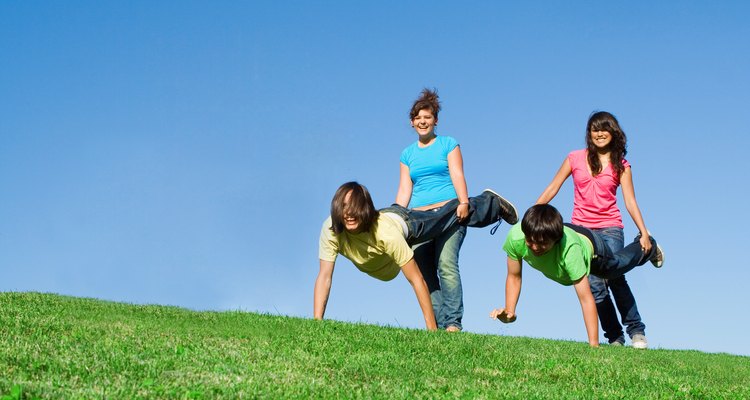 diverse  group of active teens playing outdoors