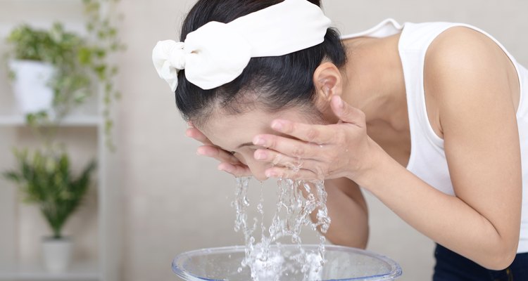 Woman washing her face