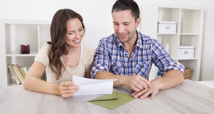 Happy Couple Reading Paper