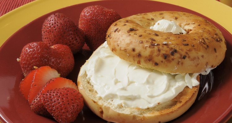 Toasted bagel with cream cheese and strawberries