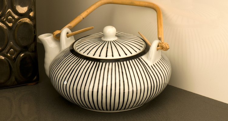 Dress up a plain teapot with a painted pattern.