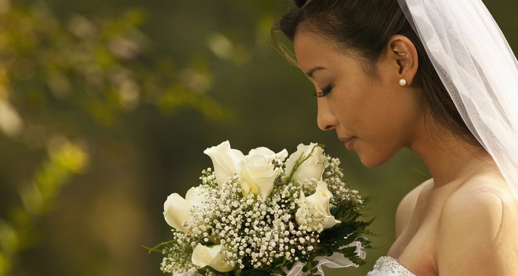 bride smelling flowers