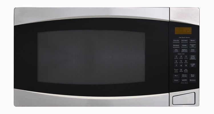 Stainless steel microwave oven on white