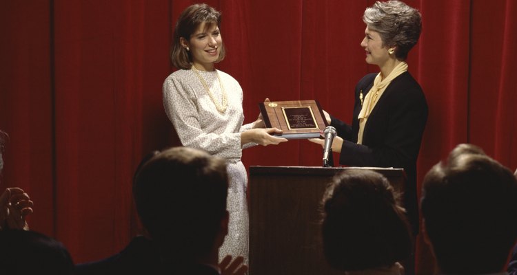 When presenting an award make sure your right hand is free to shake with the recipient.