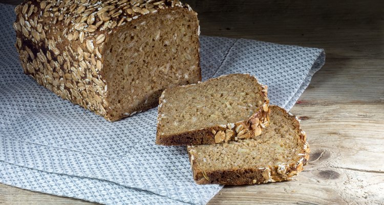 rye bread with whole grain on a napkin and wood