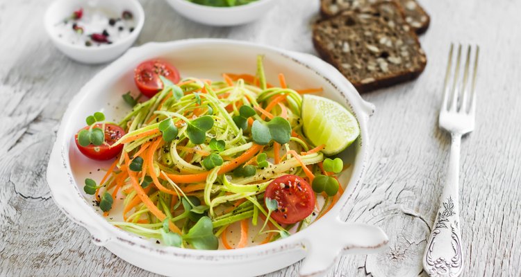 fresh salad with zucchini and carrots in a  vintage plate