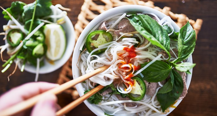 vietnamese pho with spicy sriracha sauce shot top down