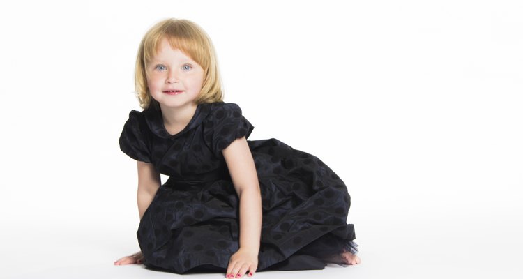 blonde 5 year old girl kneeling