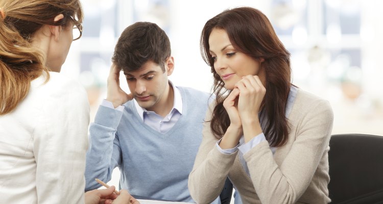 Young couple discussing financial plan with consultat