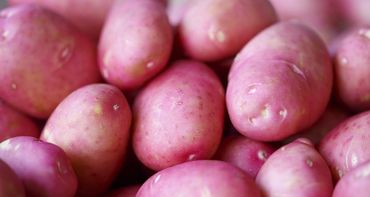 Red potatoes on the market, Colorful photo of red potatoes with defocused background, Selective focus with shallow depth of field