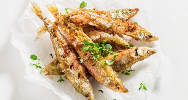 Delicious smelt fish and chips with salt and herbs