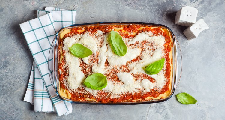 classic vegetarian lasagna on a gray stone background
