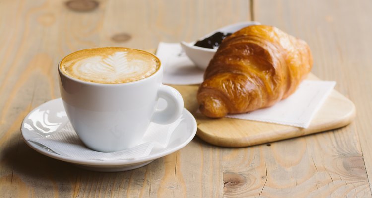 Coffee and Croissant on a wooden table