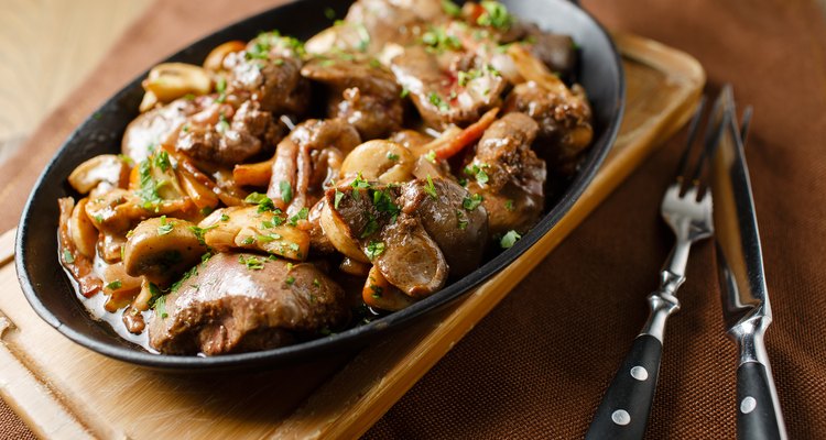 Liver baked with mushrooms, bacon and herbs