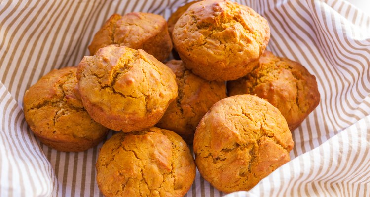 Freshly-baked pumpkin muffins in a food basket