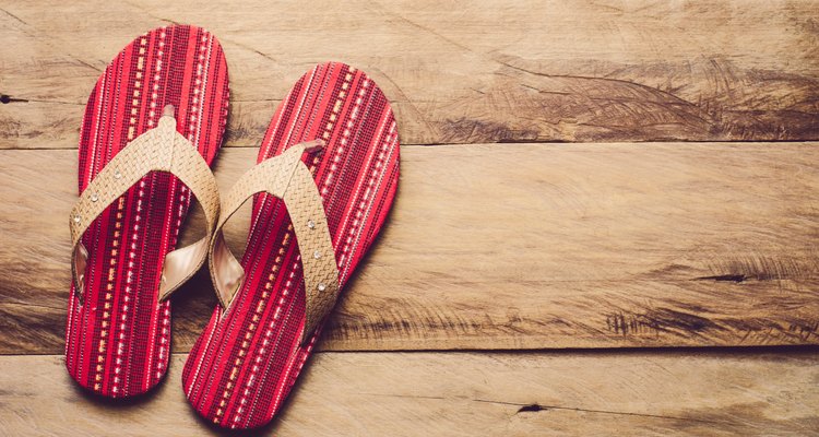 Directly Above Shot Of Flip-Flop On Wooden Floor