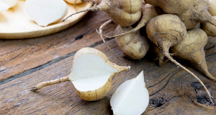 fresh cut asian jicama on wooden board