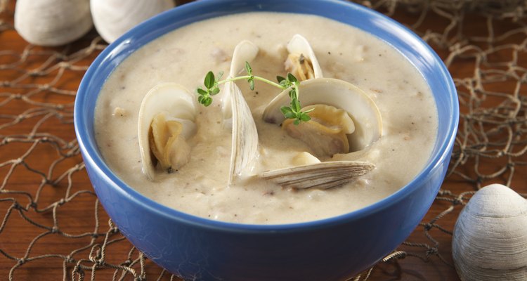 Clam chowder with a sprig of seasoning